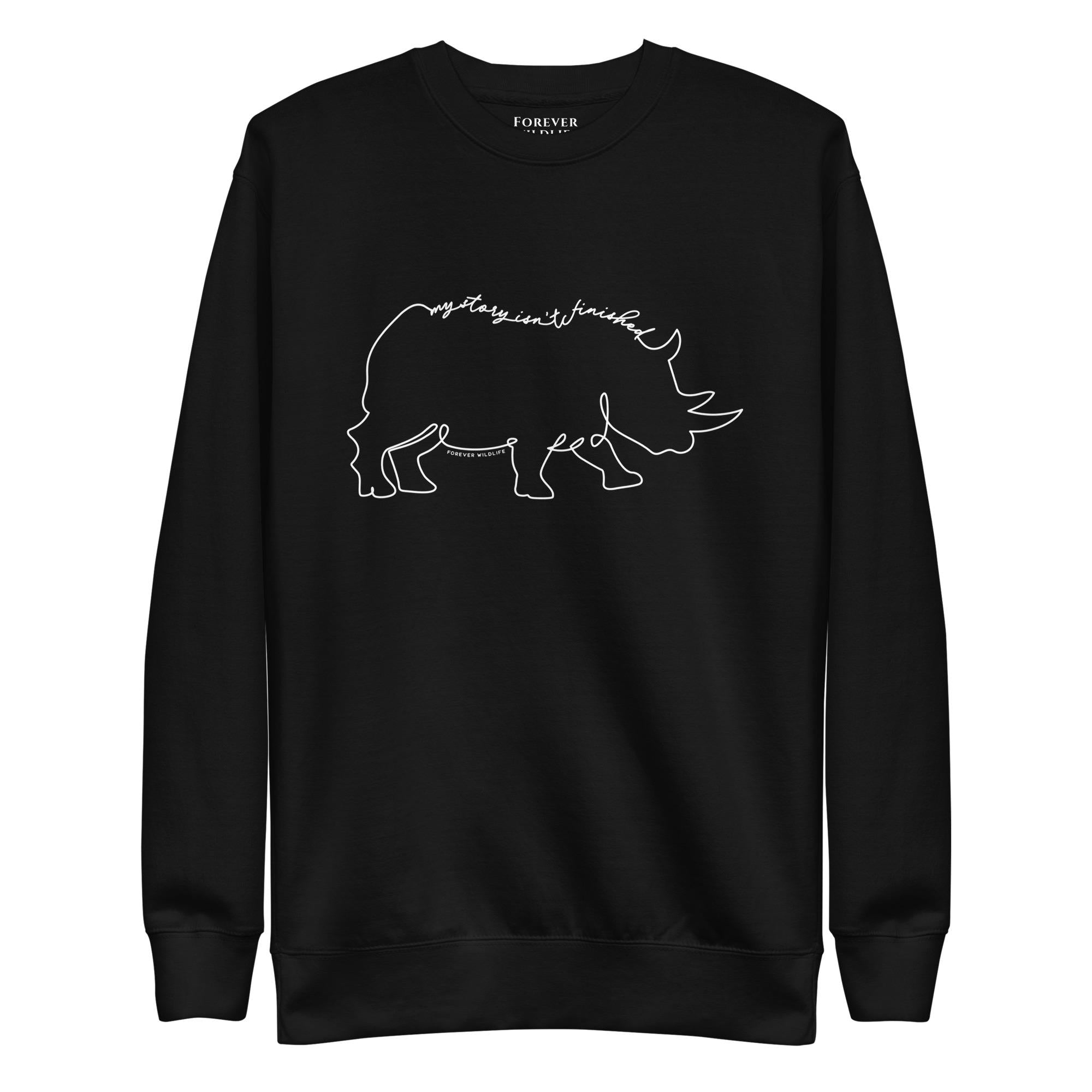 Rhino Sweatshirt in Black-Premium Wildlife Animal Inspiration Sweatshirt Design with 'My Story Isn't Finished' text, part of Wildlife Sweatshirts & Clothing from Forever Wildlife.