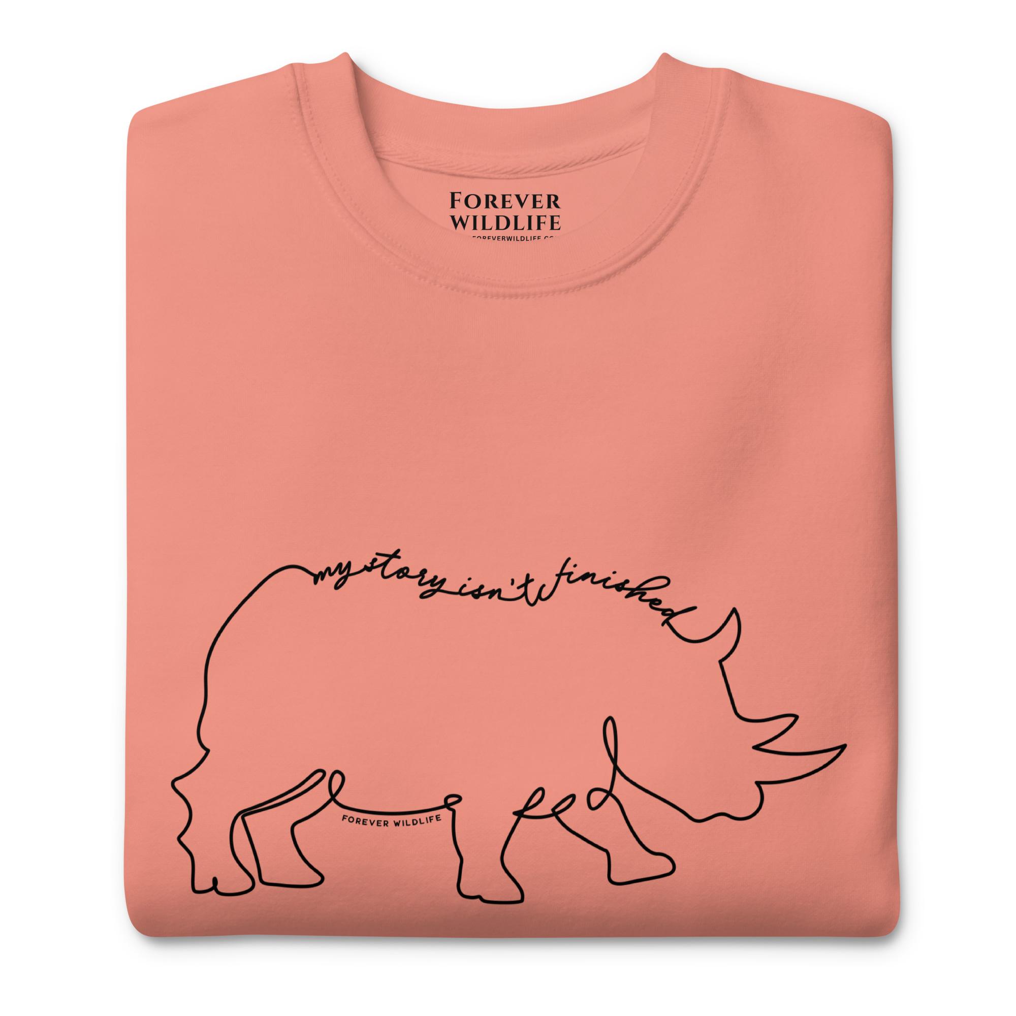 Rhino Sweatshirt in Rose-Premium Wildlife Animal Inspiration Sweatshirt Design with 'My Story Isn't Finished' text, part of Wildlife Sweatshirts & Clothing from Forever Wildlife.
